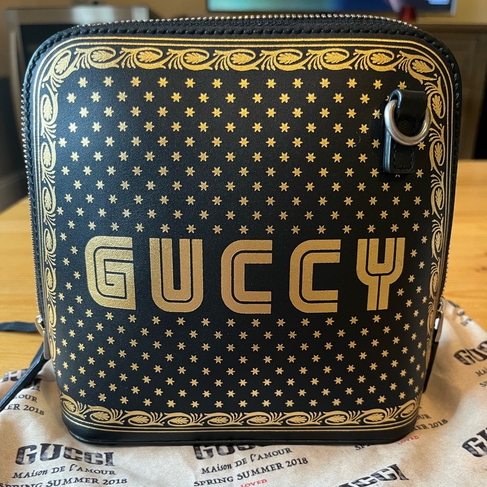 ❤️Black and Gold Gucci printed leather crossbody bag with "GUCCY" in SEGA® font